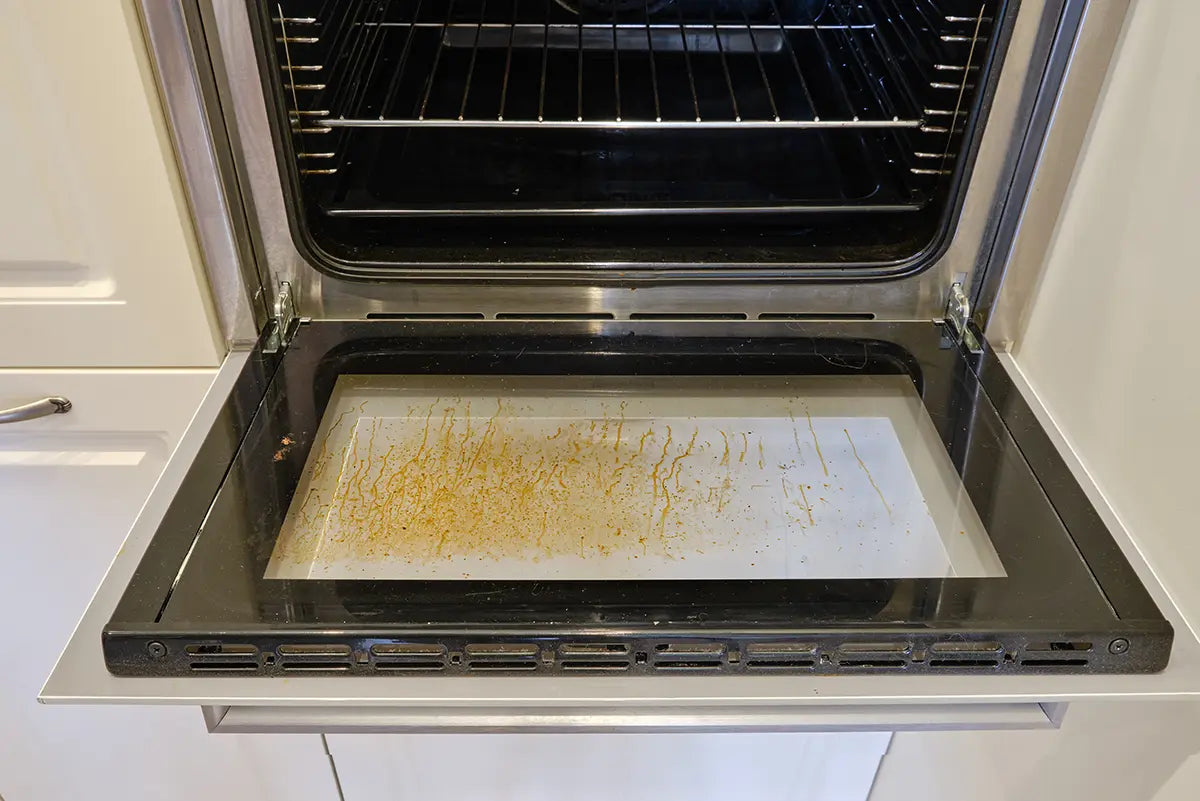 Oven grease and grime before Quick 'n Brite cleaning